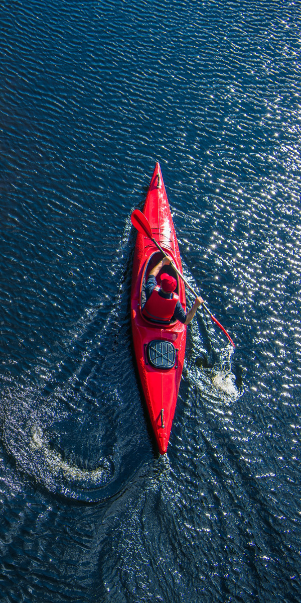 Red kayak on blue water